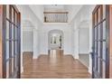 Grand foyer showcasing soaring ceilings, hardwood floors, and architectural details at 511 Millwood Ct, Canton, GA 30114
