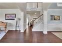 Spacious foyer with hardwood floors, staircase, and elegant architectural details at 194 Lakestone Parkway, Woodstock, GA 30188