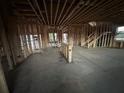 Unfinished interior with exposed wooden beams and stud walls awaiting customization at 3191 Morris Hills Dr, Dacula, GA 30019