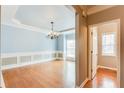 Open-concept living room boasts light blue walls, hardwood floors, and large windows at 215 Aldridge Pl # 9, Smyrna, GA 30082