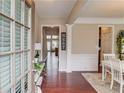 Inviting foyer with hardwood floors, neutral paint, and views into the dining and living spaces at 2479 Brynfield Cv, Suwanee, GA 30024