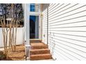 Welcoming front entrance with brick steps and a glass-paneled door, showcasing the home's curb appeal at 503 Stanford Pl, Woodstock, GA 30188