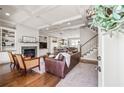 Cozy living room features a fireplace, hardwood floors, built-in shelving, and comfortable seating at 196 Wingo St, Norcross, GA 30071