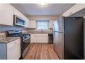 Modern kitchen featuring white cabinets, stainless steel appliances, and granite countertops at 1770 Lynn Ln, Decatur, GA 30032