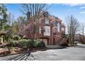 Brick home with traditional architectural details, a two-car garage, and a nicely landscaped front yard at 1029 Fairway Ne Ests, Atlanta, GA 30319