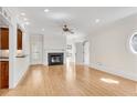 Bright living room features a fireplace, hardwood floors, and modern ceiling fan at 1029 Fairway Ne Ests, Atlanta, GA 30319