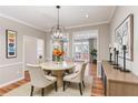 Formal dining room with hardwood floors, decorative chandelier, and an abundance of natural light at 2515 Oak Quarters, Smyrna, GA 30080