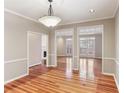 Elegant dining room with hardwood floors, white trim, and modern lighting fixtures at 2515 Oak Quarters, Smyrna, GA 30080