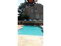 Refreshing pool with plenty of seating, perfect for relaxation and entertainment on hot summer days at 2515 Oak Quarters, Smyrna, GA 30080