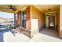Inviting front porch with stone accents, a bench, and a view of the neighborhood at 422 Windy Ridge Way, Canton, GA 30114