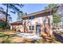 Home's backyard featuring a brick facade, a concrete patio perfect for outdoor entertaining at 1618 Cheryl Leigh Dr, Riverdale, GA 30296