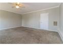 Neutral bedroom with plush carpeting, white trim, and a ceiling fan at 1935 Cutters Mill Way, Lithonia, GA 30058