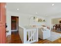 Open entryway with hardwood floors leading to a bright living room and a glimpse of the dining area at 2592 Valley Stream Dr, Atlanta, GA 30360