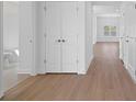 Bright hallway with wood floors, closet and view to living area at 1209 Cedarcrest Blvd, Acworth, GA 30101