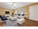 Bright living room with hardwood floors, white sofa, and contemporary decor at 2670 Foxlair Trl, Atlanta, GA 30349