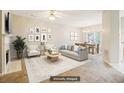 Staged living room area with fireplace, view of dining area, and natural light at 1624 River Main Ct, Lawrenceville, GA 30046