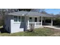 Charming one story home featuring a freshly painted exterior, and covered carport at 2405 Cross Nw St, Atlanta, GA 30318