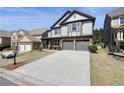 Beautiful home with two-car garage and large driveway offers ample parking at 5470 Beaver Ridge Dr, Cumming, GA 30040