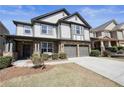 Well maintained two-story home, featuring a two-car garage and charming front yard landscaping at 5470 Beaver Ridge Dr, Cumming, GA 30040
