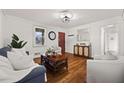 Bright living room with hardwood floors, comfortable seating, and natural light at 127 Oldenburg Dr, Riverdale, GA 30274