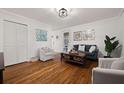 Stylish living room features hardwood floors, white walls, and modern decor at 127 Oldenburg Dr, Riverdale, GA 30274