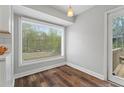 Cozy breakfast nook featuring a large window with natural light and hardwood floors at 700 Bayliss Dr, Marietta, GA 30068