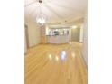 Open-concept living area boasts hardwood floors and natural light at 390 17Th Nw St # 2024, Atlanta, GA 30363