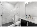 Stylish bathroom featuring a tiled walk-in shower, sleek vanity, and modern fixtures at 343 Concord St, Alpharetta, GA 30009