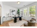 Bright office space with hardwood floors, a modern desk, natural light, and views of the outdoors at 343 Concord St, Alpharetta, GA 30009