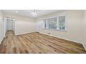 Bright living room with hardwood floors and a modern chandelier at 1467 Thompson Pl, Decatur, GA 30032