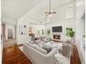 Bright living room with high ceilings, fireplace, and abundant natural light at 3932 E Saddle Ridge Dr, Lithonia, GA 30038