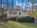 Charming home featuring stone accents, manicured greenery, and a cozy front porch at 1184 Broward Ne Dr, Marietta, GA 30066