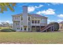 Expansive backyard featuring a deck with stairs, and a screened-in porch at 345 Oakwind Pt, Acworth, GA 30101