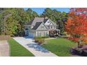 Stunning home featuring an extended driveway and beautifully landscaped front yard at 345 Oakwind Pt, Acworth, GA 30101