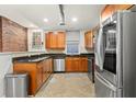 Spacious kitchen with stainless steel appliances and wooden cabinets at 616 N Highland Ne Ave # 13B, Atlanta, GA 30306