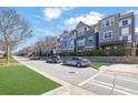 Exterior view showcasing townhomes with attractive landscaping and street parking at 108 Blakemore Se Dr, Smyrna, GA 30080