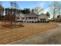 Beautiful home featuring manicured landscaping and a long driveway leading to the property at 21 Fortson Dr, Hampton, GA 30228