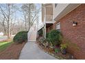 Beautiful brick home exterior with a charming garden and a well-maintained walkway at 3114 Superior Dr, Dacula, GA 30019