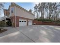 Spacious two-car garage with ample parking space and a well-maintained driveway at 3114 Superior Dr, Dacula, GA 30019