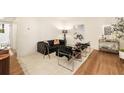 Bright living room with a stylish sofa, unique chairs, and contemporary decor at 435 10Th Ne St # 18, Atlanta, GA 30309