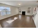 Bright living room with hardwood floors, a fireplace, and plenty of natural light at 272 Laurel Canyon Pkwy, Canton, GA 30114