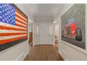 Elegant foyer with hardwood floors and art, creating a welcoming entrance at 15 Paces West Nw Dr, Atlanta, GA 30327