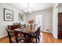 Bright dining room featuring hardwood floors, stylish decor, and natural light at 4210 Gladney Dr, Atlanta, GA 30340