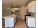 New kitchen with white cabinets, stainless steel appliances, and a marble island at 125 Laurel Farms Ln, Dallas, GA 30157