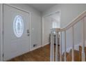 Bright entryway with hardwood floors, staircase and a white door, creating a welcoming first impression at 2736 Old Norcross Rd, Tucker, GA 30084