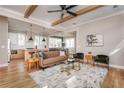 Bright, open living room featuring hardwood floors, exposed beams, modern furnishings, and an open floor plan at 185 Marion # A, Atlanta, GA 30307