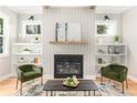 Inviting living room with a fireplace, built-in bookshelves, and comfortable seating at 185 Marion # A, Atlanta, GA 30307