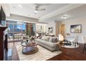 Bright living room with fireplace, comfortable seating, and expansive windows offering city views at 2881 Peachtree Ne Rd # 704, Atlanta, GA 30305