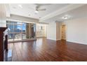 Open-concept living space featuring hardwood floors, large windows, and neutral color palette at 2881 Peachtree Ne Rd # 704, Atlanta, GA 30305