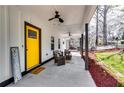 Inviting front porch with ceiling fans and cozy seating area, great for enjoying the outdoors at 236 Barfield Sw Ave, Atlanta, GA 30310